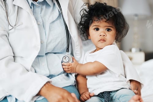 Preview: Shot of a little baby girl holding onto the stethoscope of her doctor