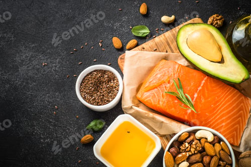 Preview: Healthy fats products at black background.