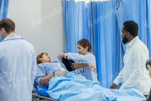 Preview: Doctor Visiting Patient On Ward. Hospitalized man lying in bed while doctor checking his.