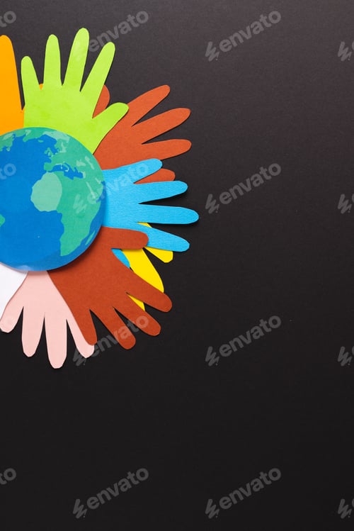 Preview: Paper cut out of multi coloured hands and globe with copy space on black background