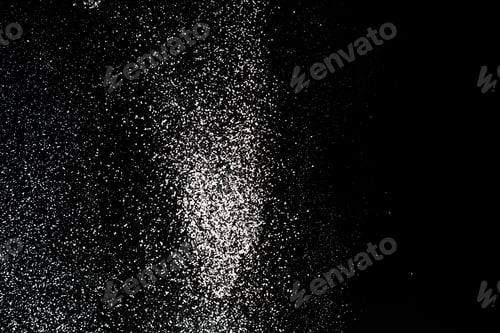 Preview: Flour sifting on a black background. White powder splash isolated on black background