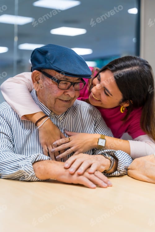 Preview: Nurse embracing a elder man in a geriatric