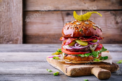 Preview: homemade burger with whole grain bun and fried bacon