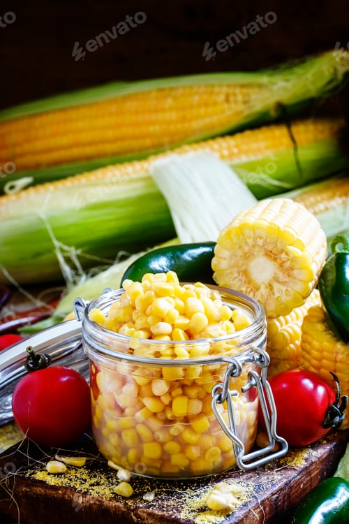 Preview: Canned corn and spices, old wooden background, selective focus