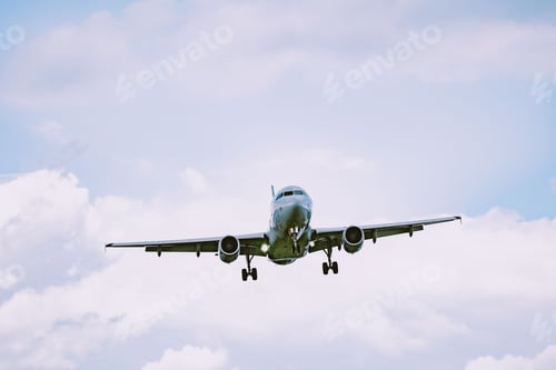 Preview: Beautiful view of an airplane flying in a cloudy sky