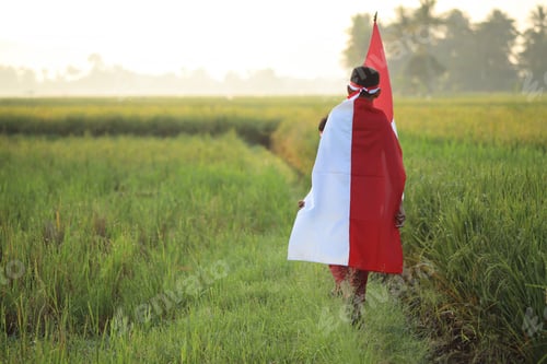 Preview: Indonesia kid wearing flag atribute celebrating independence day