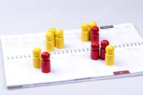 Preview: Closeup of dates in a calendar indicated by red and yellow figures