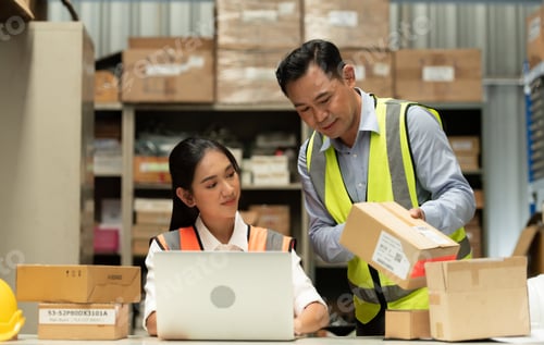 Preview: Warehouse Manager with female assistant Rethink a plan to prepare items