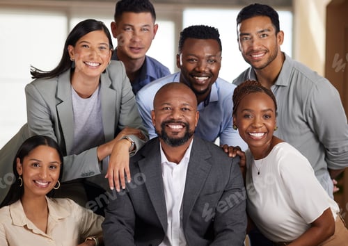 Preview: Cropped portrait of a diverse group of businesspeople posing in their office