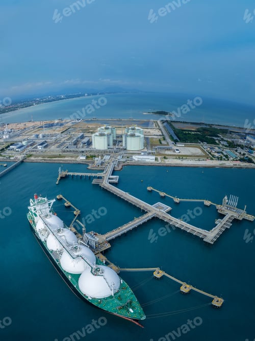 Preview: LNG (Liquified Natural Gas) tanker anchored in Gas terminal gas tanks for storage. Oil Crude Gas