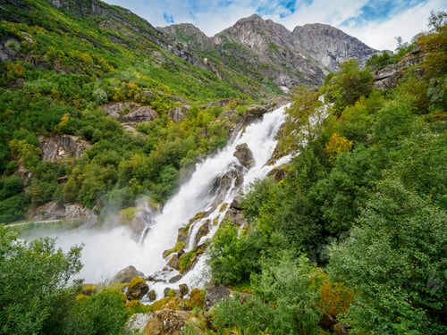 Preview: Kleivafossen waterfalls and mountains near briksdalsbreen Glacier in Norway.