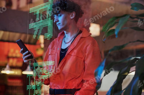 Preview: Guy with smartphone standing by panel with hieroglyphs meaning best ramen