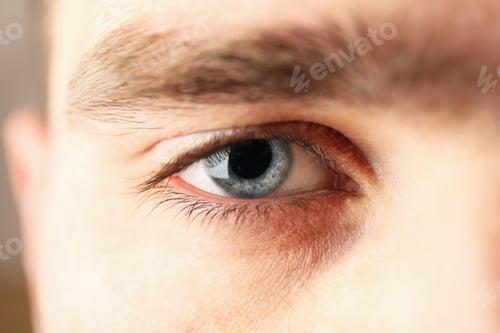 Preview: Beautiful mans blue eye, closeup. Macro. Healthcare and medical concept