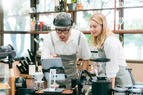 Preview: Customer using smartphone to scan QR code for order menu in cafe restaurant with digital delivery