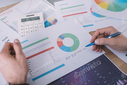 Preview: Cropped view of information security analyst planning strategy with charts at table