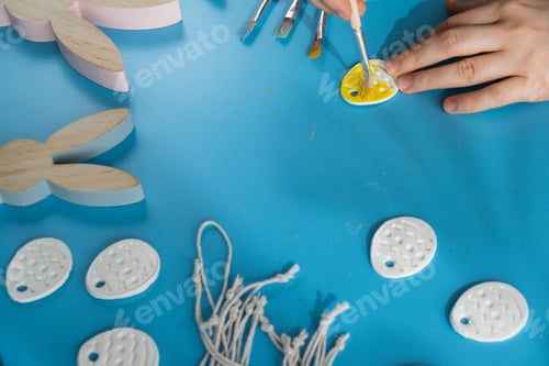 Preview: Unrecognizable artist do it yourself air dry clay crafts for Easter holiday. Decoration gift idea
