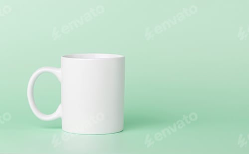 Preview: white cup for tea or coffee on a green background