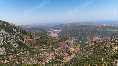Preview: Beautiful panoramic view of Crete's landscape with mountains and coastline in daytime