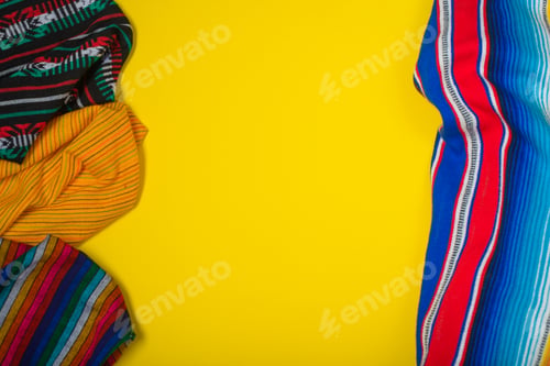Preview: Serape on yellow background. Mexican independence concept. Cinco de mayo background.