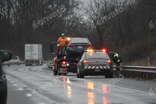 Preview: Emergency road and towing services on interstate on wet day in winter disabled vehicle Car accident