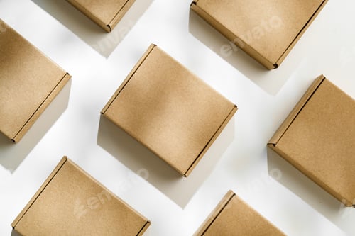 Preview: Brown cardboard boxes arranged on a light surface for packing goods in a warehouse setting