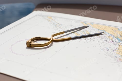 Preview: Pair of compasses for navigation on a sea map