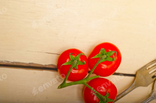 Preview: ripe cherry tomatoes over white wood
