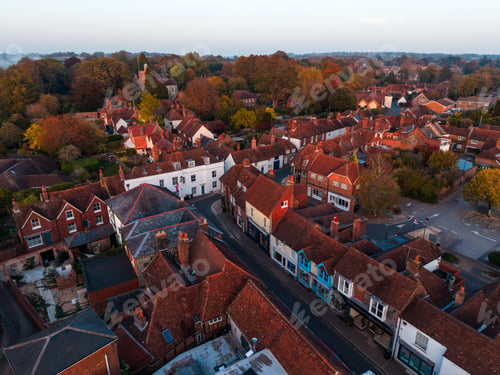 Preview: English village rooftops in autumn at sunset