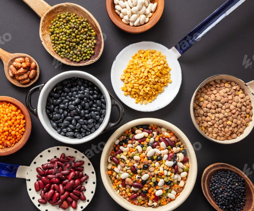 Preview: Top view flat lay of assortment of legumes on black tabletop