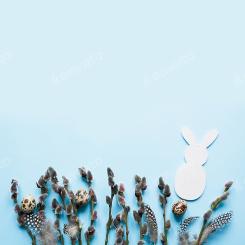 Preview: Easter creative frame of willow branch on blue background. Copy space, top view.