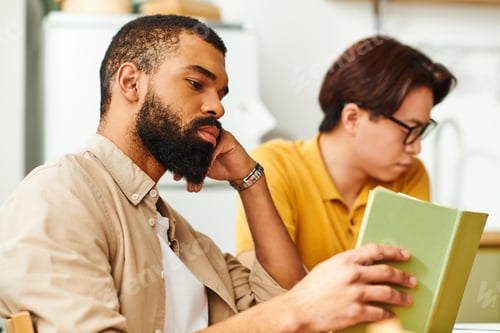 Preview: Engaging discussion among young men in a cozy book club at home atmosphere