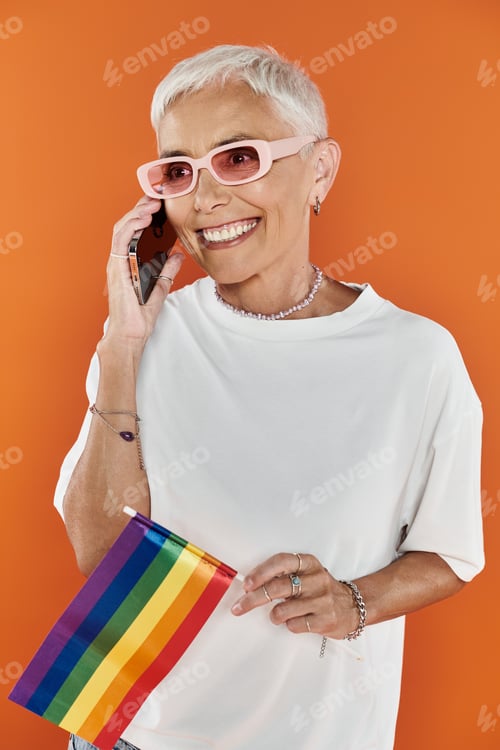 Preview: Stylish Lesbian Celebrating Pride While Engaging in a Cheerful Phone Conversation