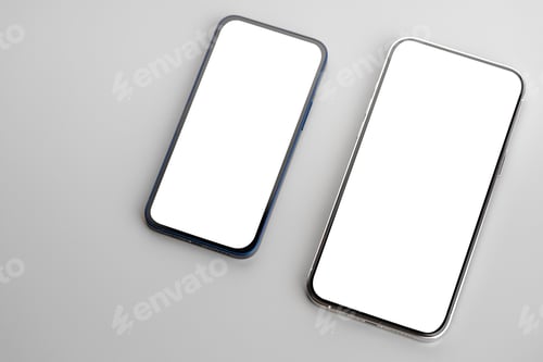 Preview: Two smartphones with blank white screen on gray background