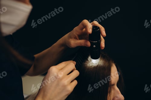 Preview: Young woman visiting trichologist in light clinic