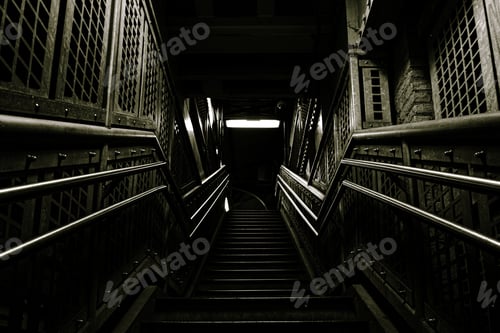 Preview: Dark metallic staircase under the lights in a building in Chicago