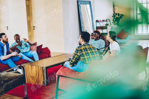Preview: Youthful hipster guys with takeaway caffeine beverages discussing weekend pastime indoors