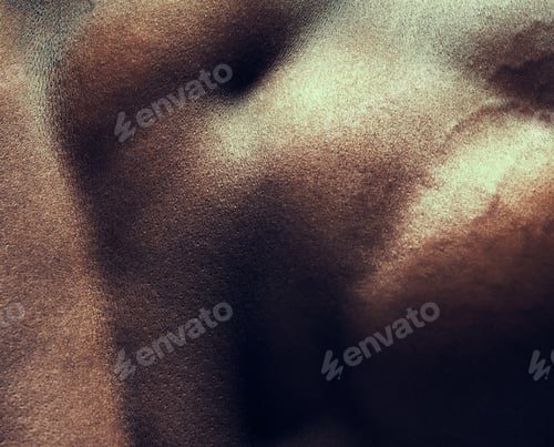 Preview: Shot of a muscular man posing against a studio background