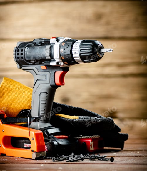 Preview: Power Drill and Tools on Wood Background