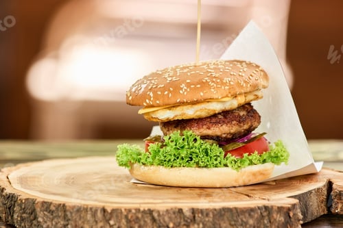 Preview: Hamburger with beef, cheese, tomato and lettuce.