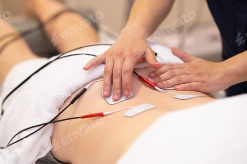 Preview: Electro stimulation in physical therapy to a young woman