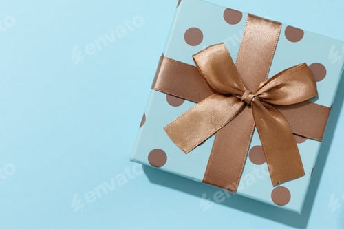 Preview: Polka Dot Gift Box with Ribbon on Blue