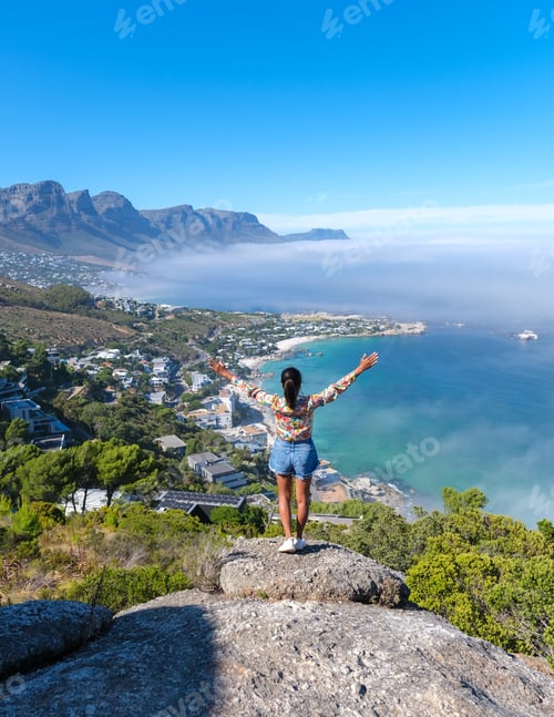 Preview: women at the viewpoint over Camps Bay named The Rock in Cape Town South Africa