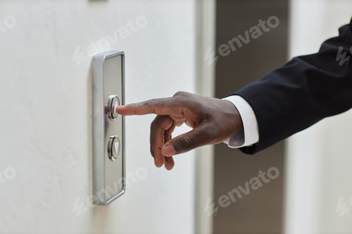 Preview: Businessman Finger Pressing Lift Button