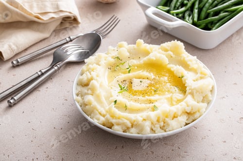 Preview: Mashed potatoes with butter in a serving bowl