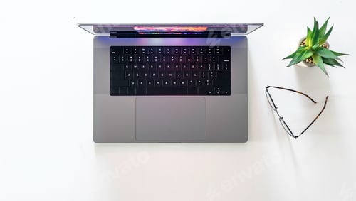 Preview: Laptop, glasses and flowerpot isolated on a white background.