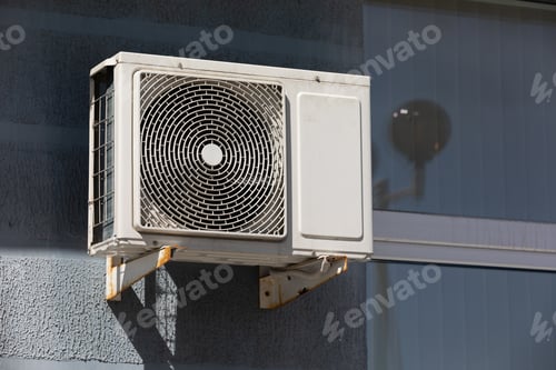 Preview: outdoor air conditioner unit on the wall of a building
