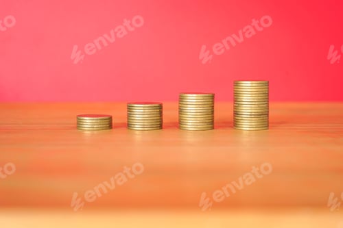 Preview: Growing Wealth: Stacks of Coins on Wood Surface