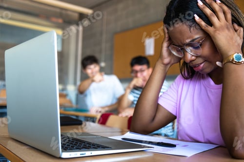 Preview: Sad female black teen high school student being bullied by classmates in class. Bullying.