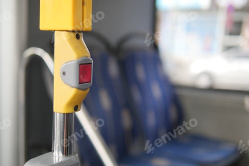 Preview: Button to request a stop on a city bus interior