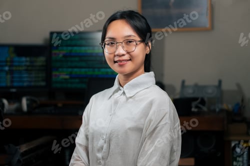 Preview: Confident Young Woman in Tech Office